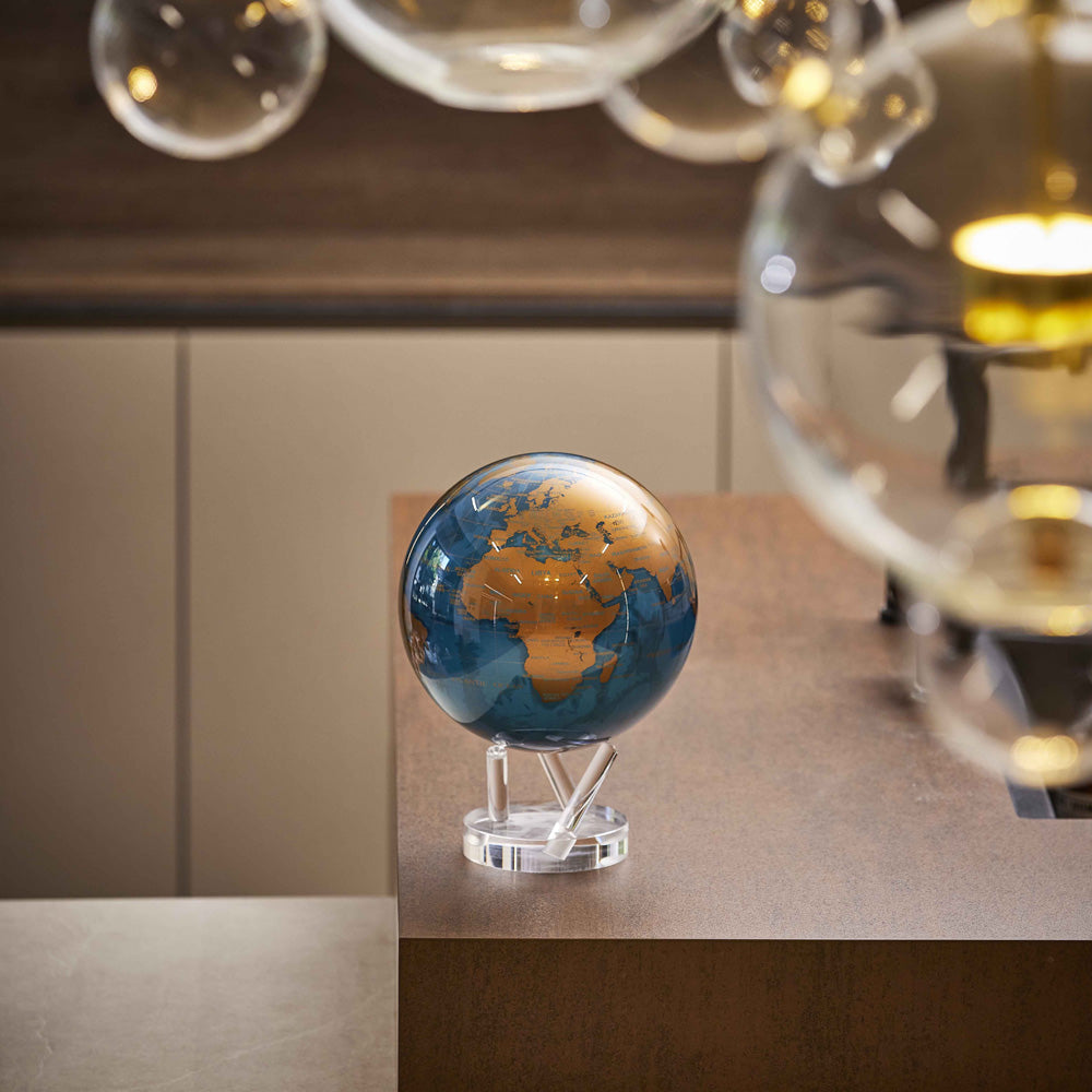 Cerulean Blue &amp; Gold MOVA Globe on acrylic base in modern interior