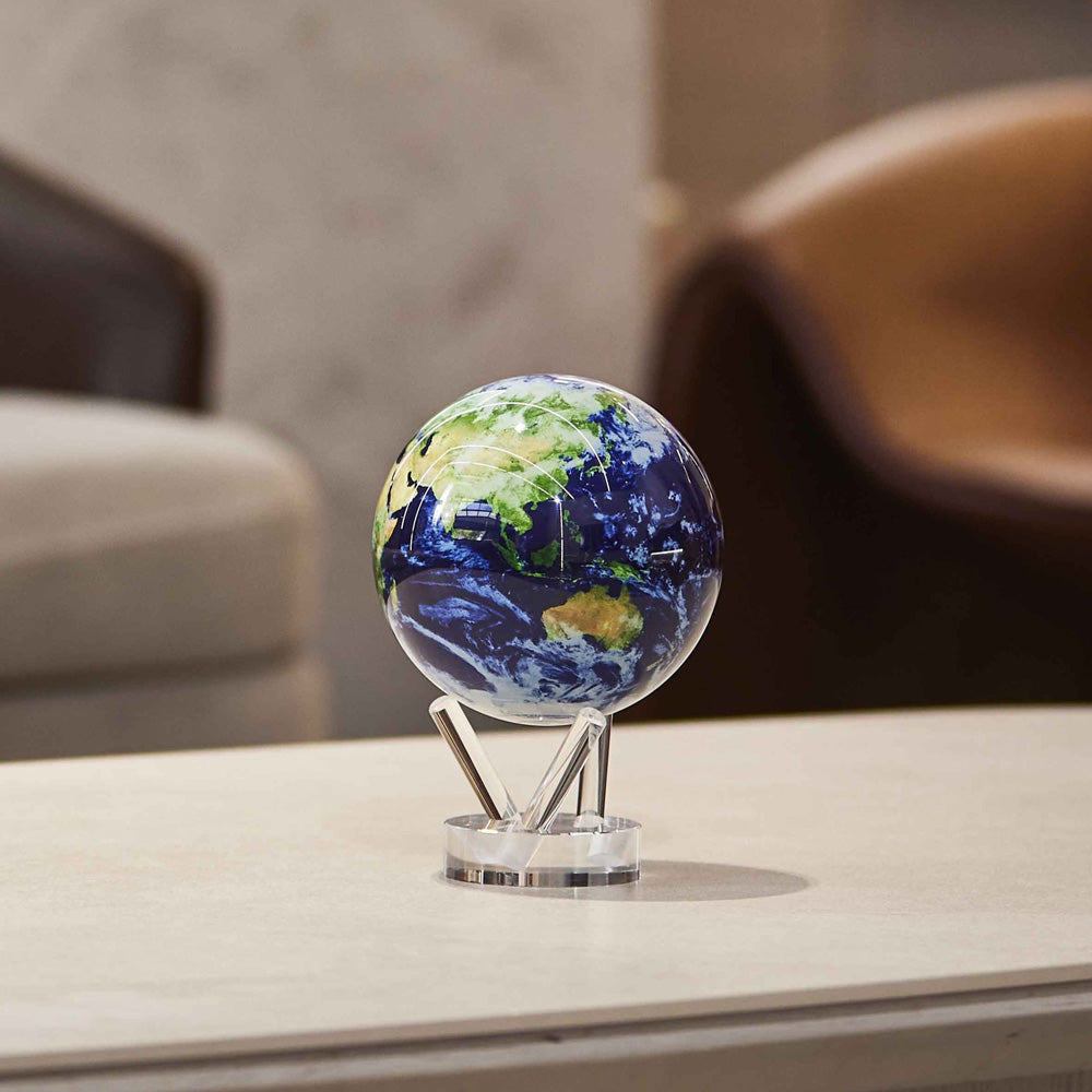 Earth with Clouds MOVA Globe displayed on coffee table with acrylic base